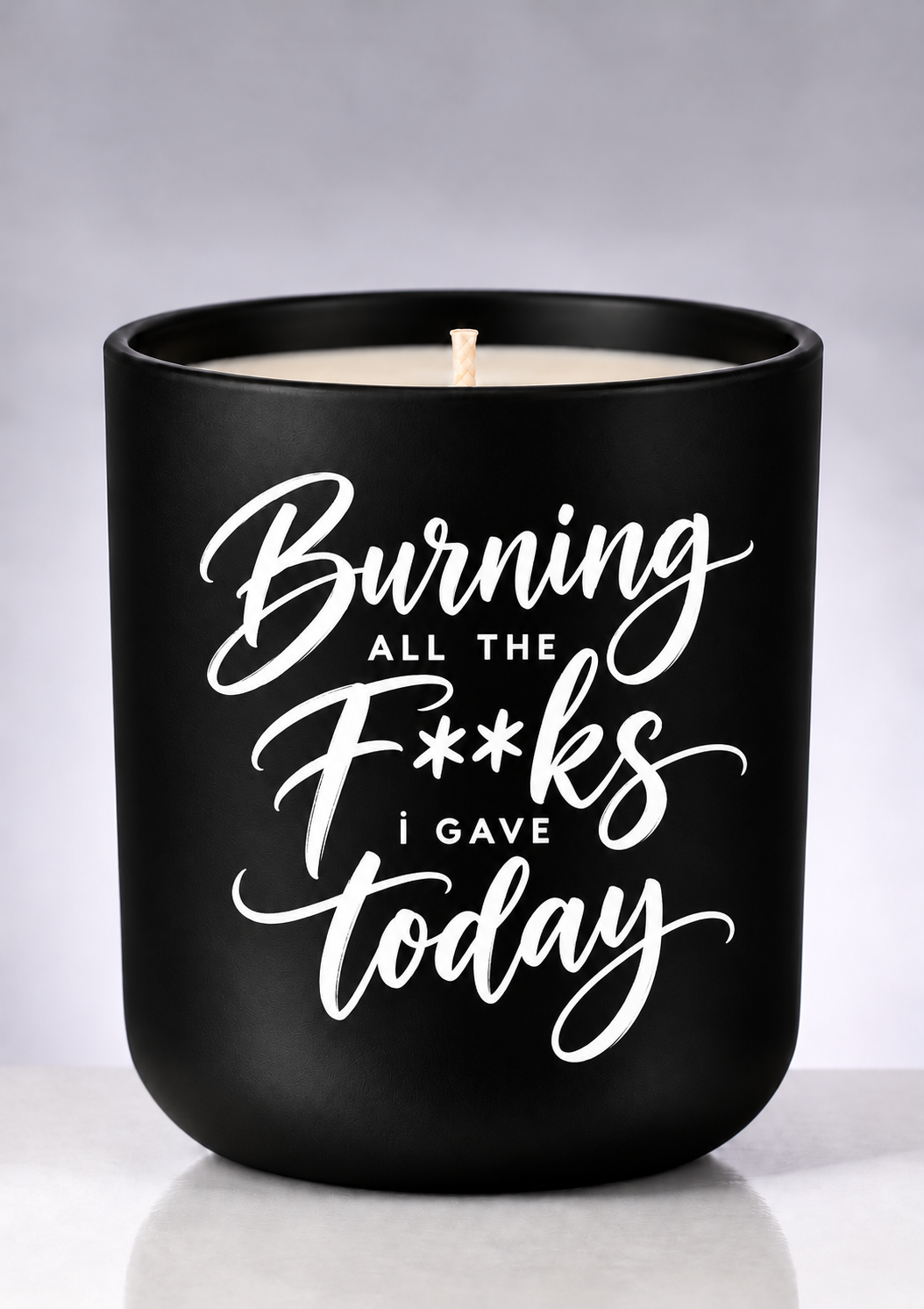 Burning all the F**ks i gave today — Soy Candle with playful white brush-script lettering on a matte-black jar