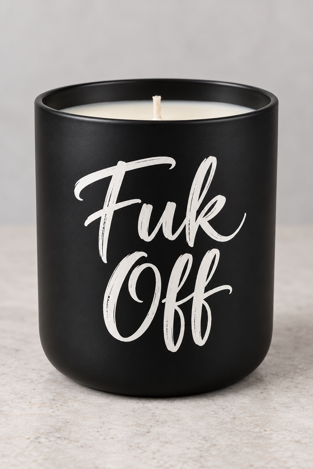 Fuk Off Bad Day soy candle with white brush-script on a matte-black jar