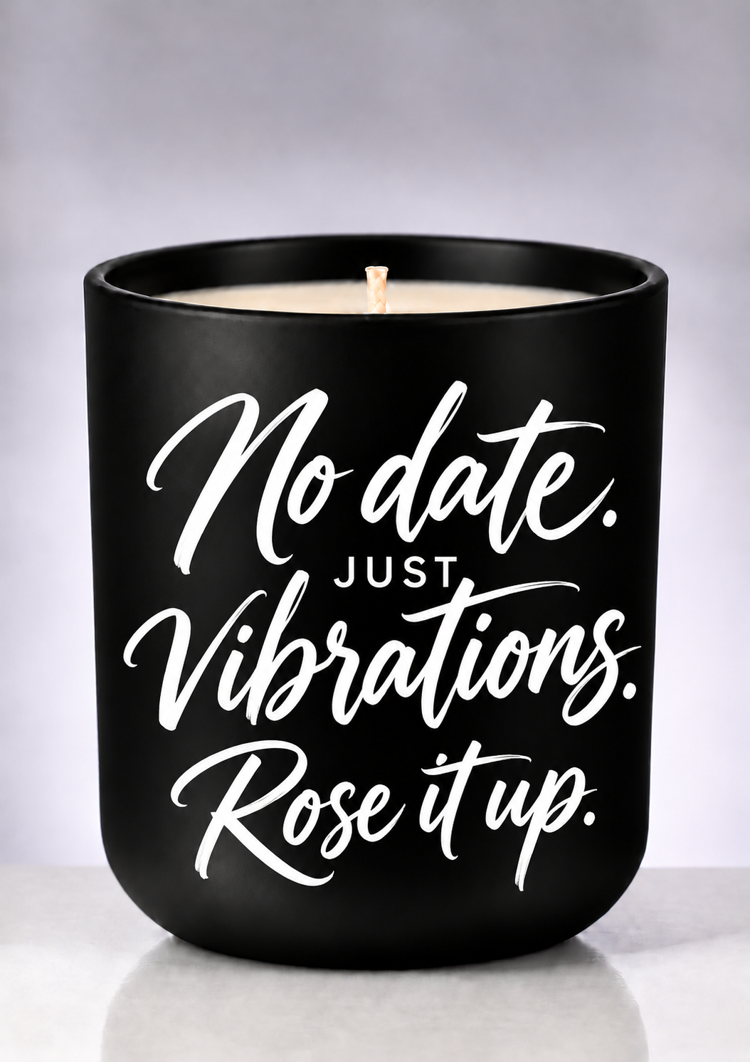 No Date. Just Vibrations. — Rose It Up Soy Candle with playful white brush-script lettering on a matte-black jar
