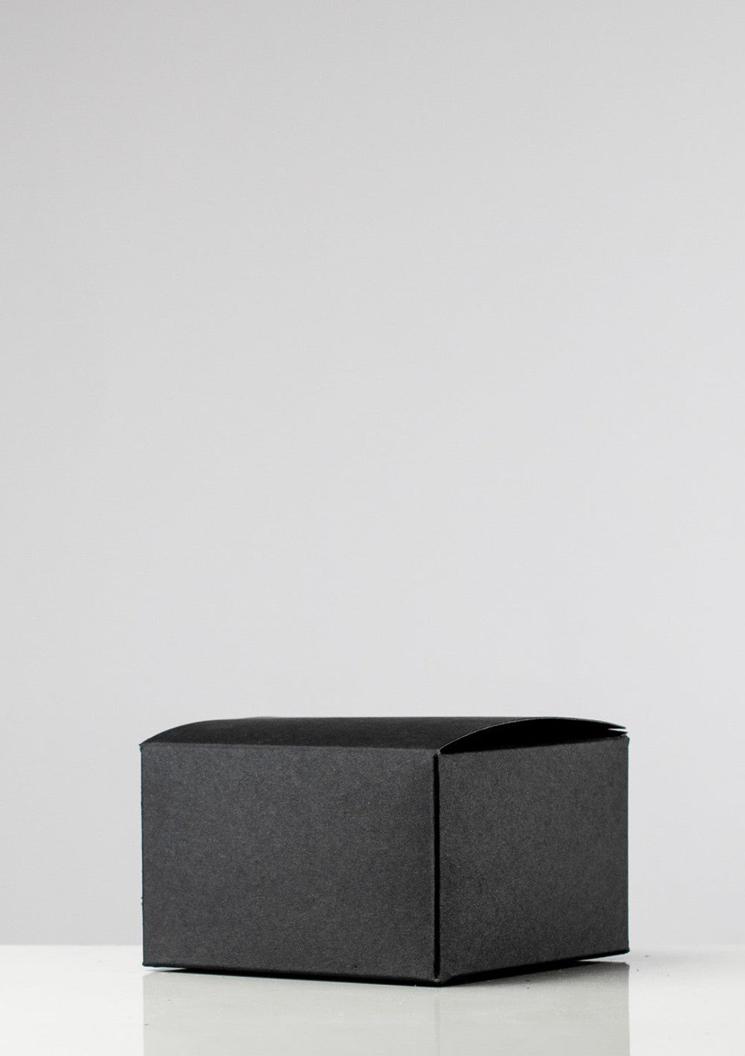Closed black candle presentation box
