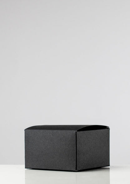 Closed black candle presentation box