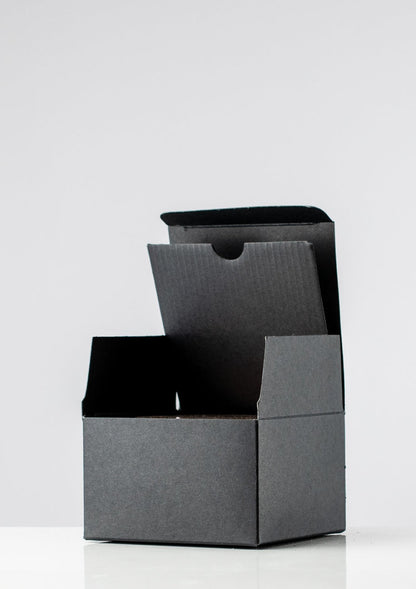 Open black candle presentation box