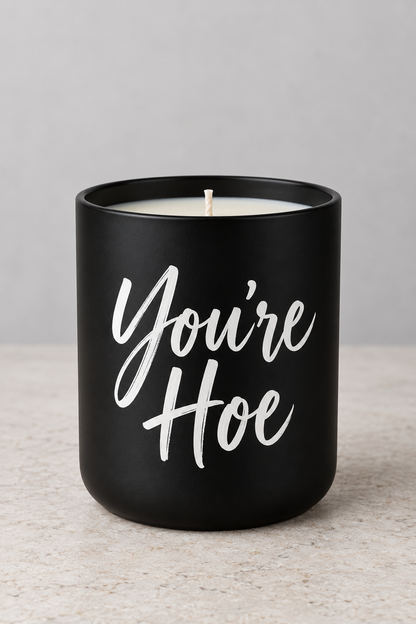 No Filter custom candle example showing You're Hoe in white script on a matte-black jar